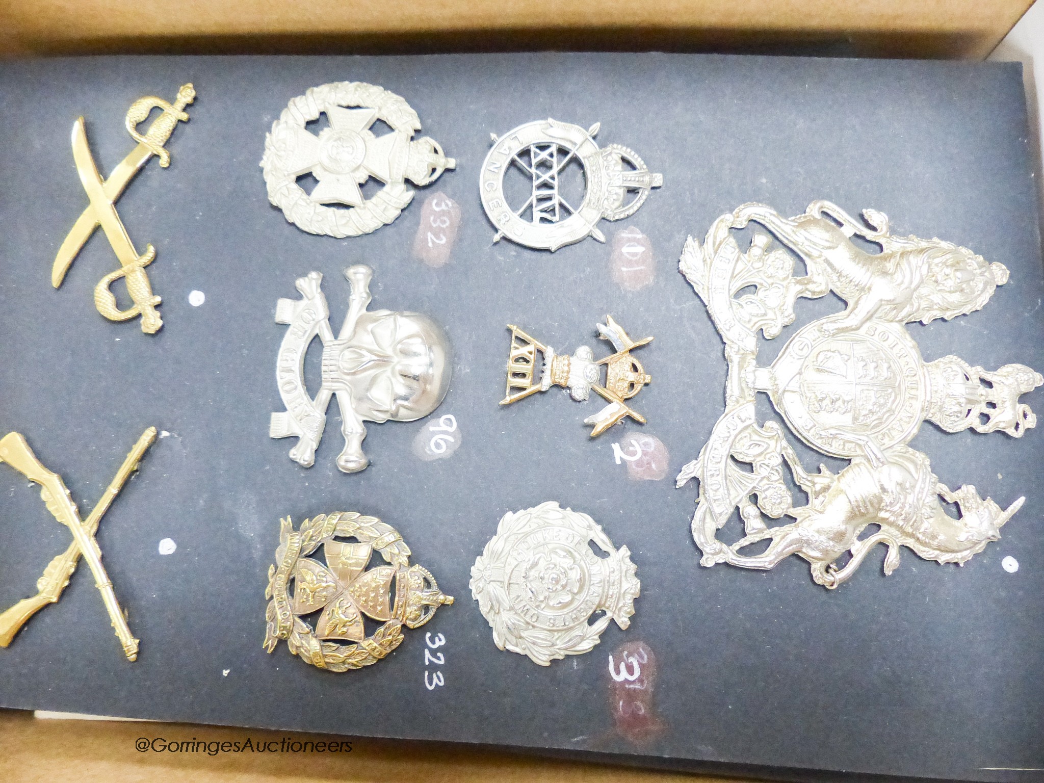 A collection of Military cap badges